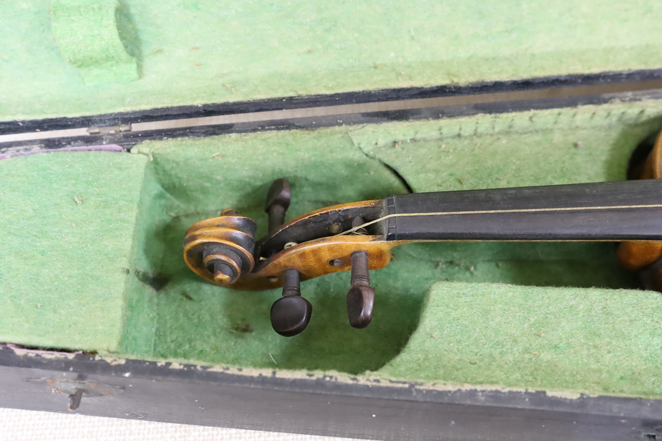 A cased German violin, 60cms long